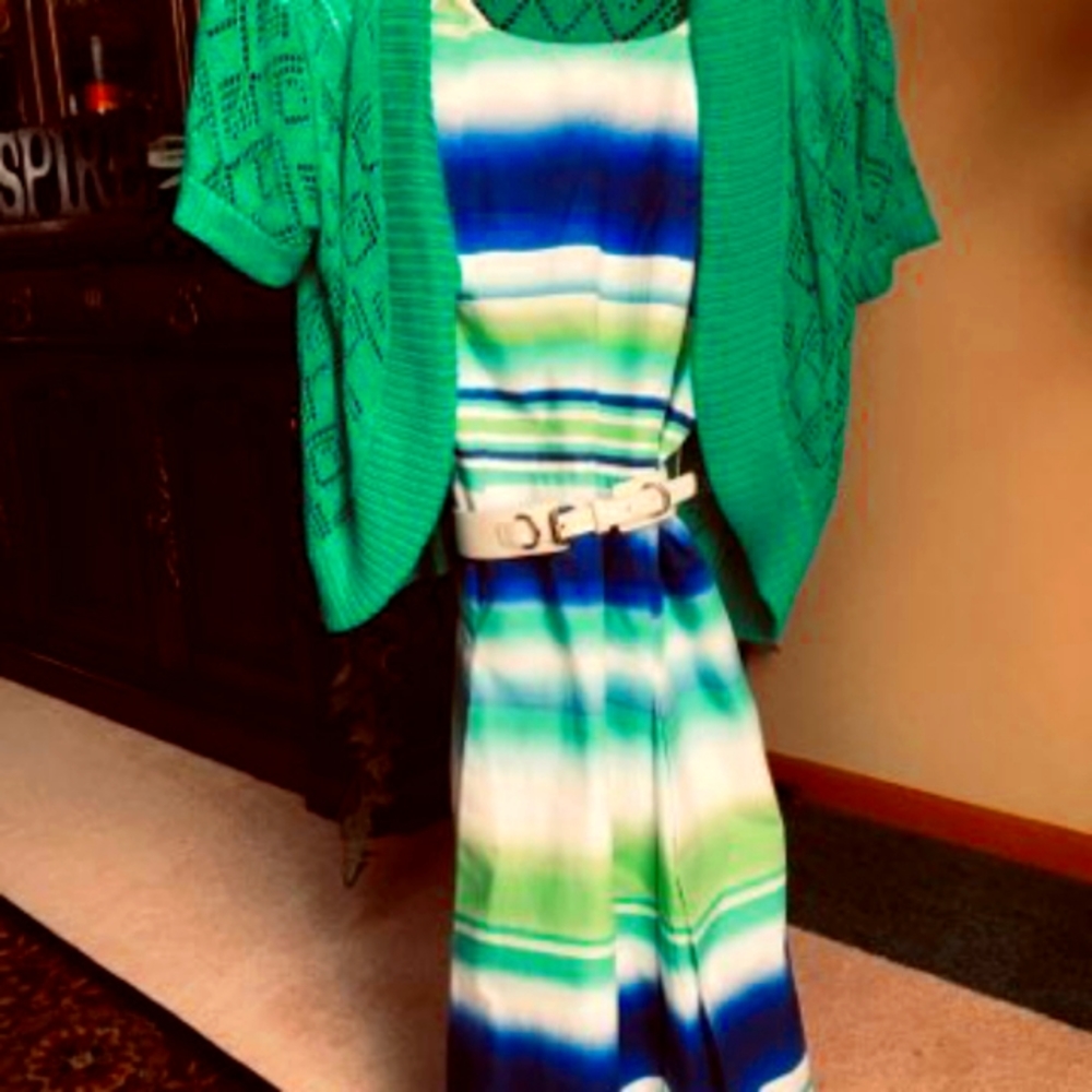 An Alex Marie dress with a green I.N studio bolo and white belt